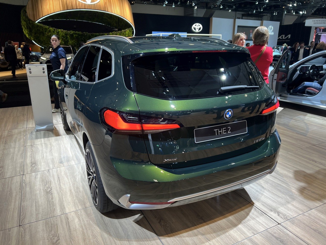 Rear view of modern compact MPV with LED taillights and xDrive badge