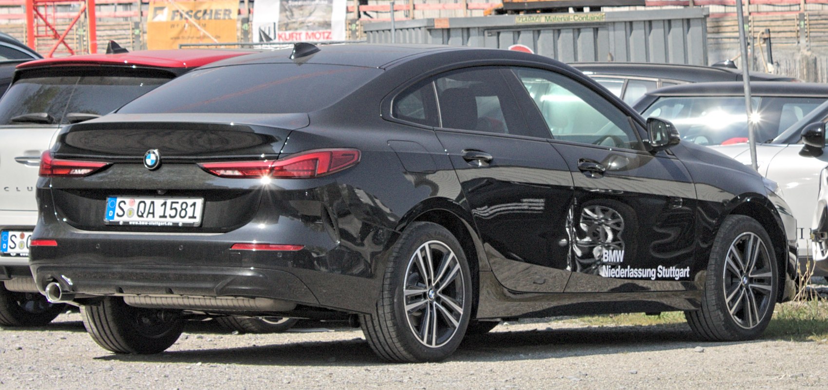 Rear view with taillights and alloy wheels of a sleek 4-door sedan