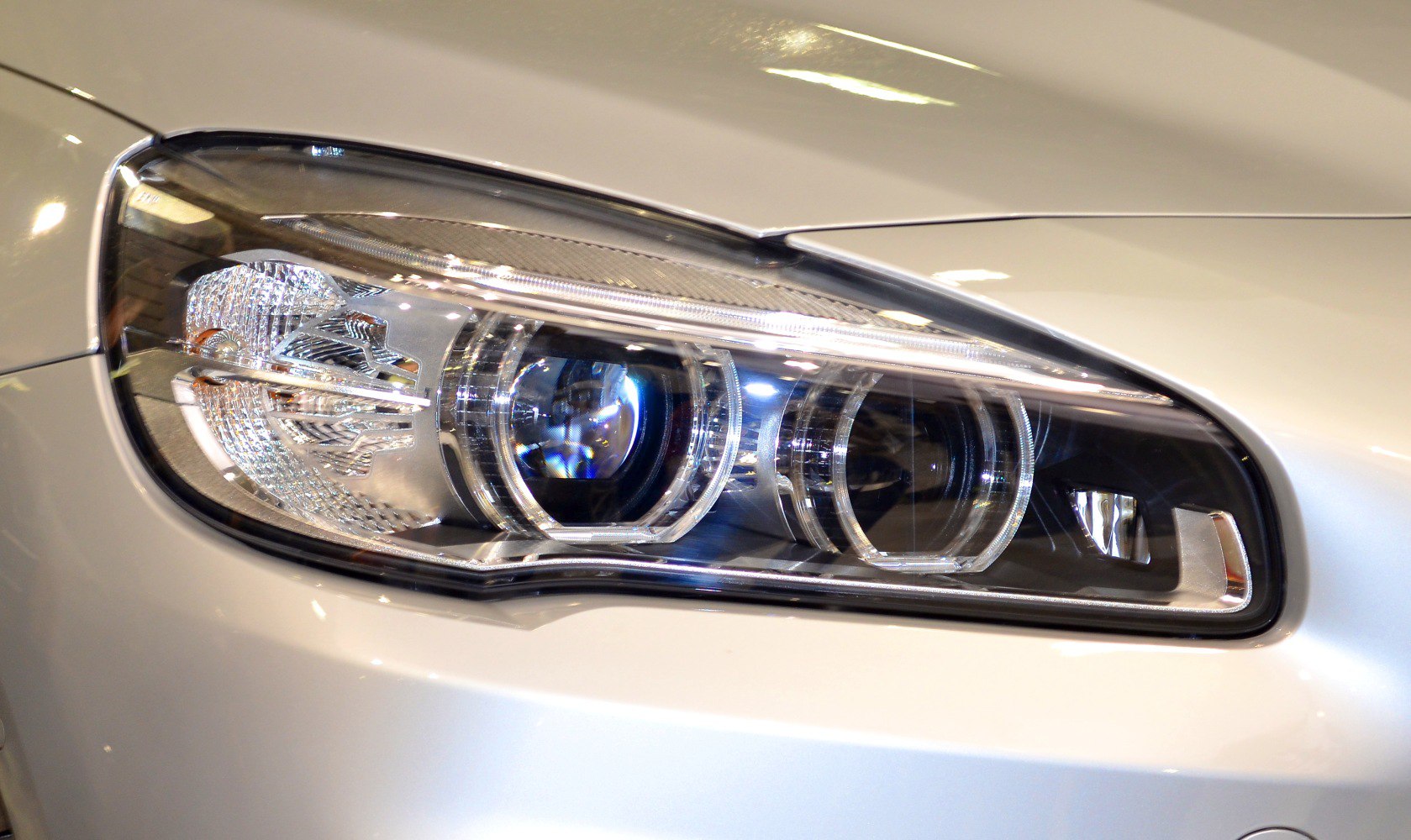 Close-up of modern projector headlight with intricate detailing