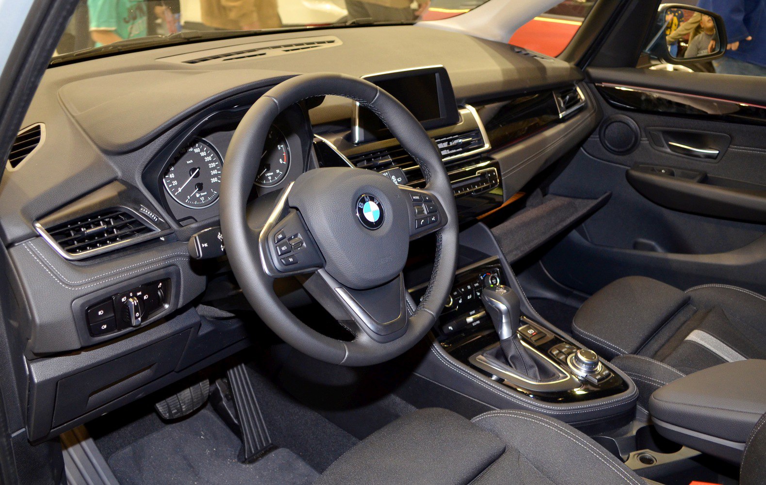 Interior dashboard and steering wheel with center console and gear shifter