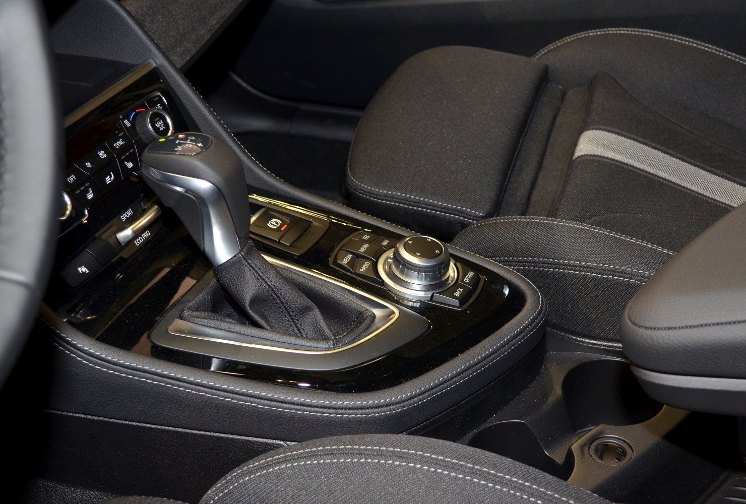 Gear shift lever and control dial center console with fabric seat