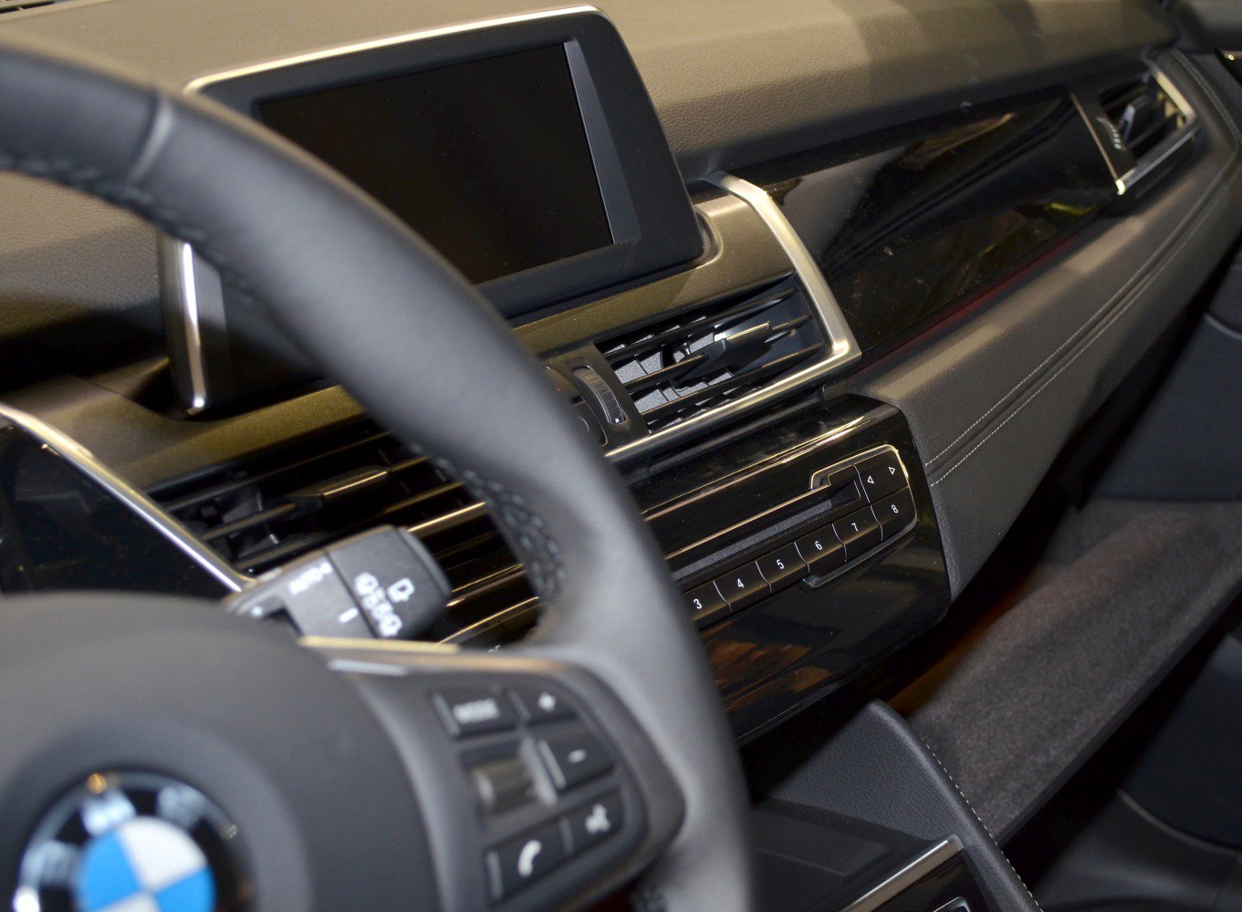 Close-up of dashboard infotainment screen and air vents