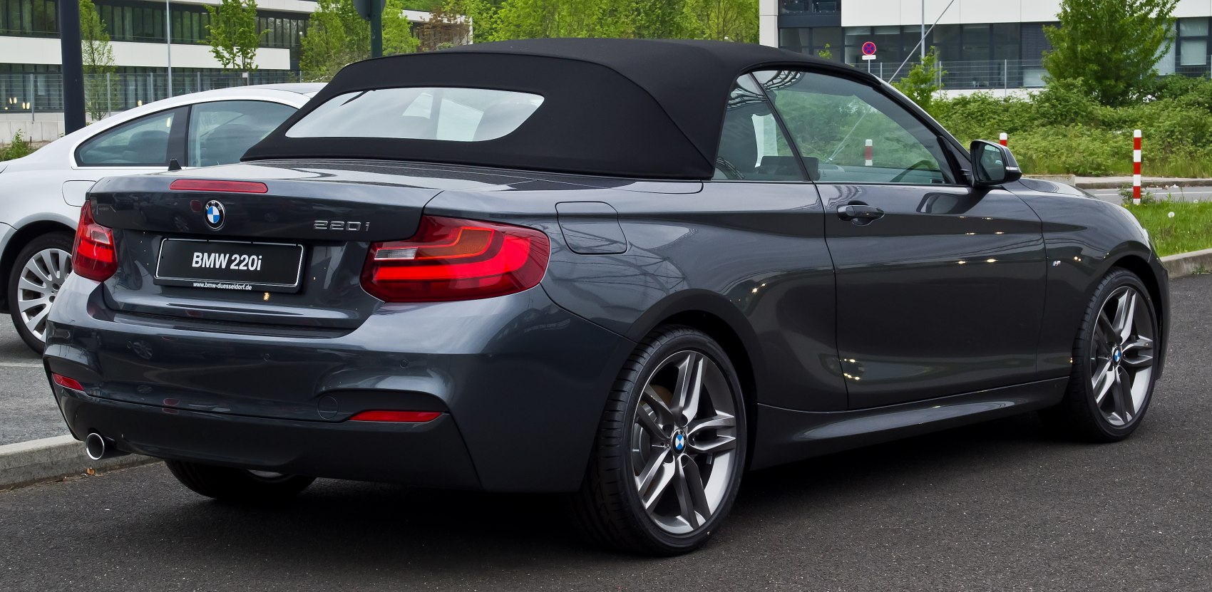 Soft top convertible rear with alloy wheels and modern taillights
