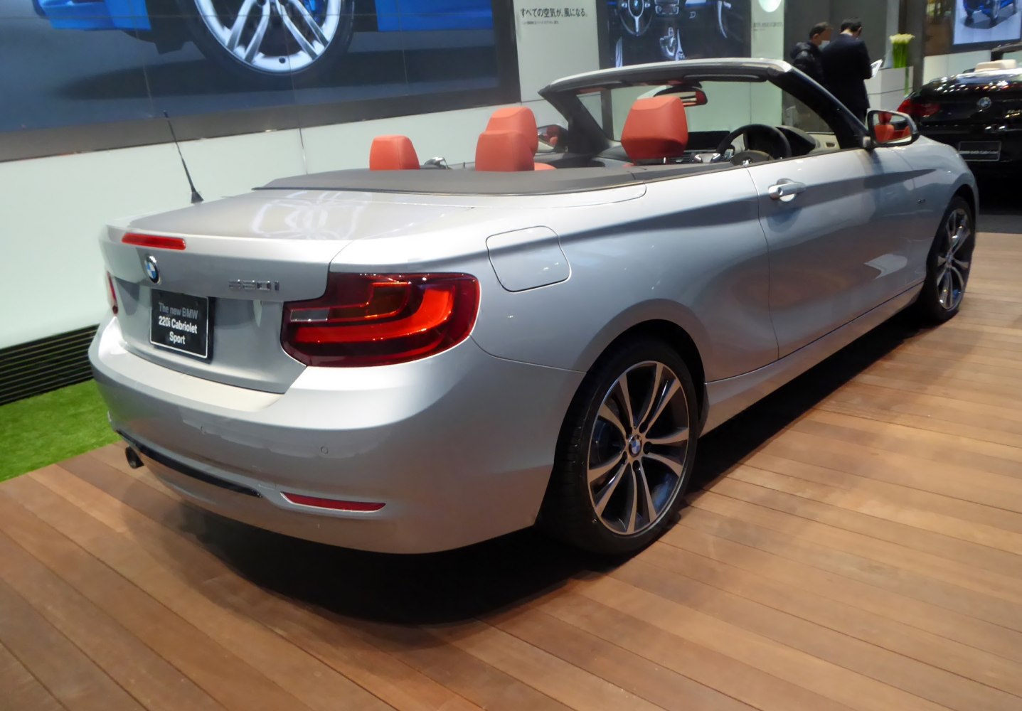 Silver convertible with red seats and rear LED tail lights