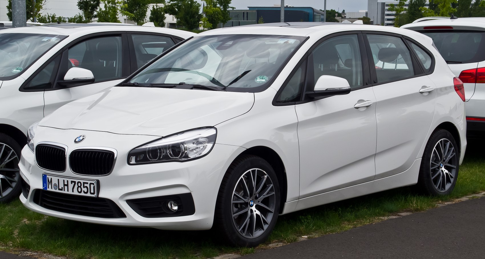 White compact hatchback with alloy wheels and fog lights