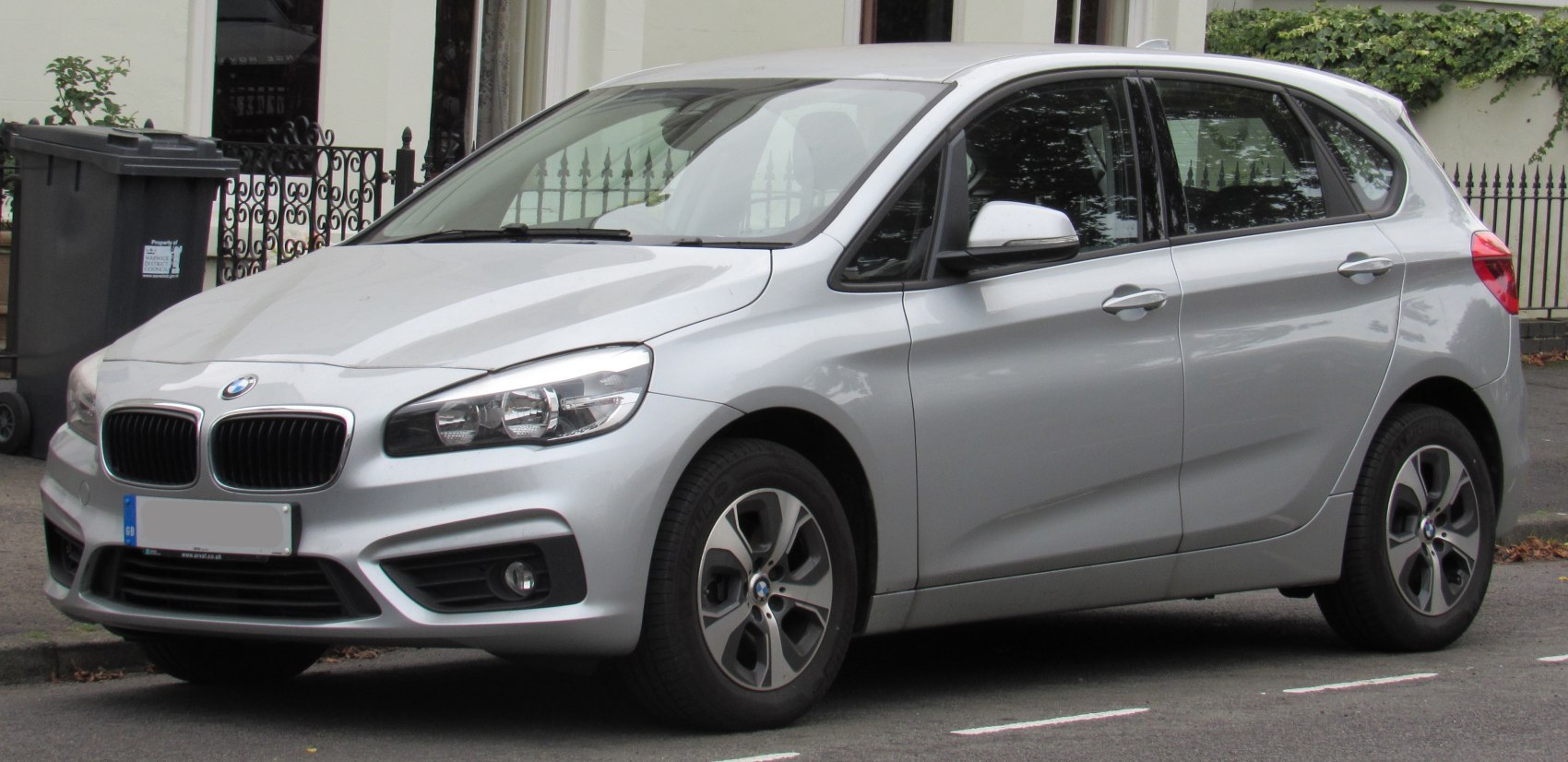 Silver compact hatchback front and side view with kidney grille and alloy wheels