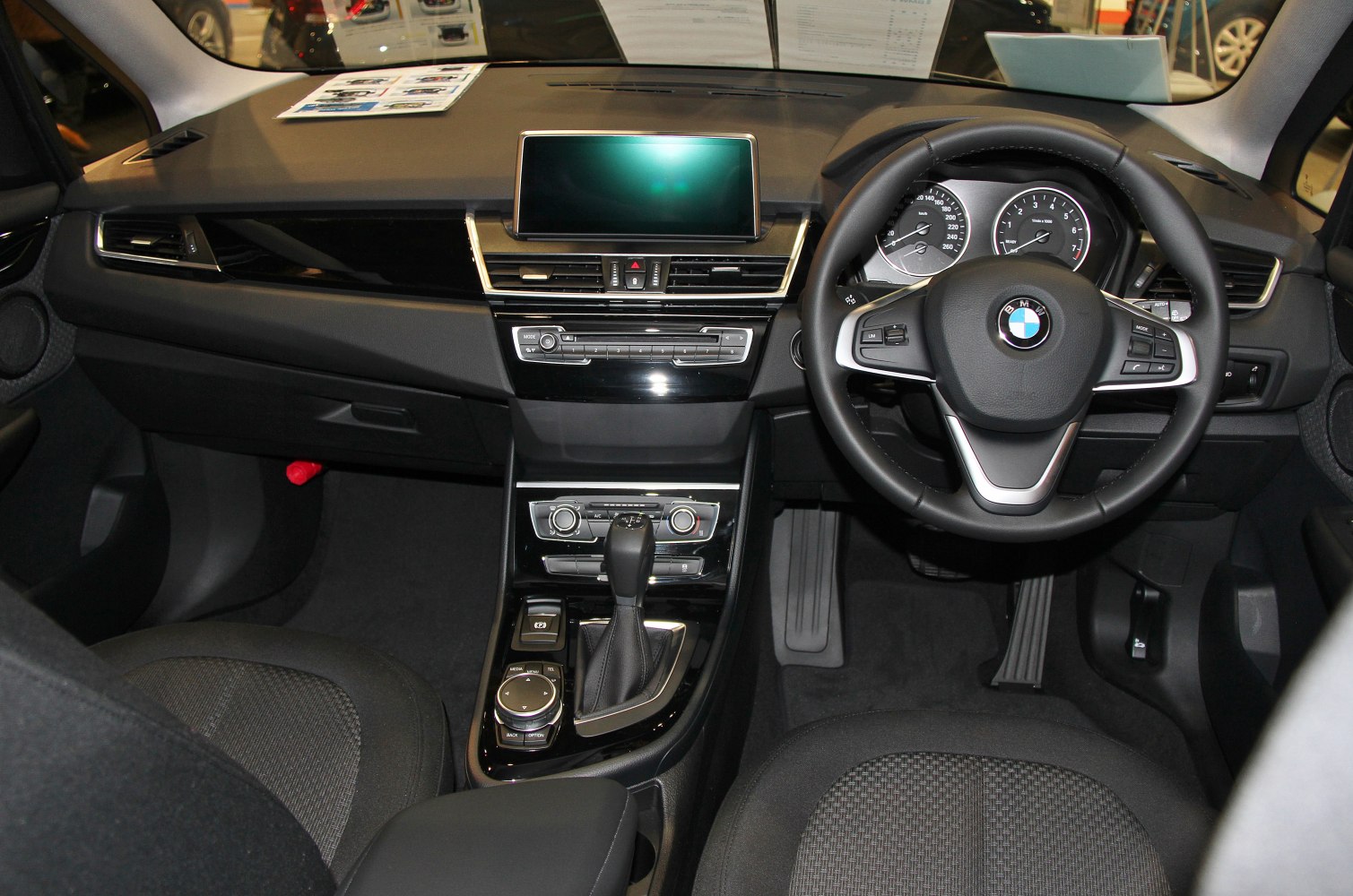 Dashboard, infotainment screen, multifunction steering wheel, and gear selector close-up