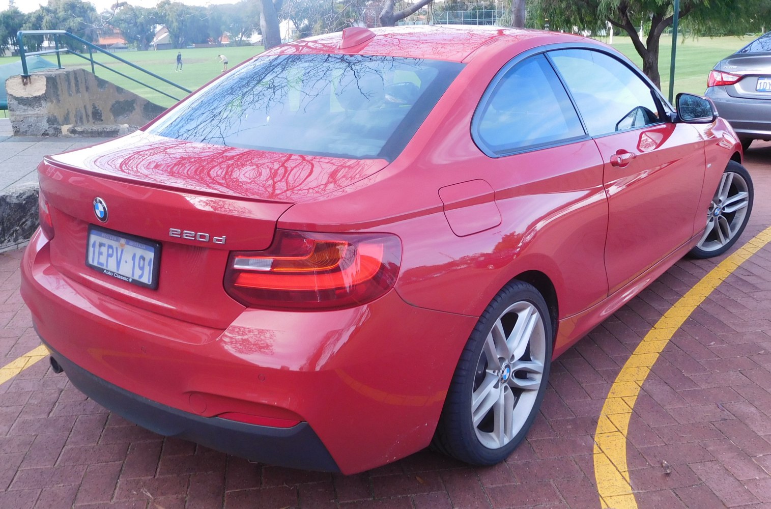 Rear side view with sporty taillights and alloy wheels