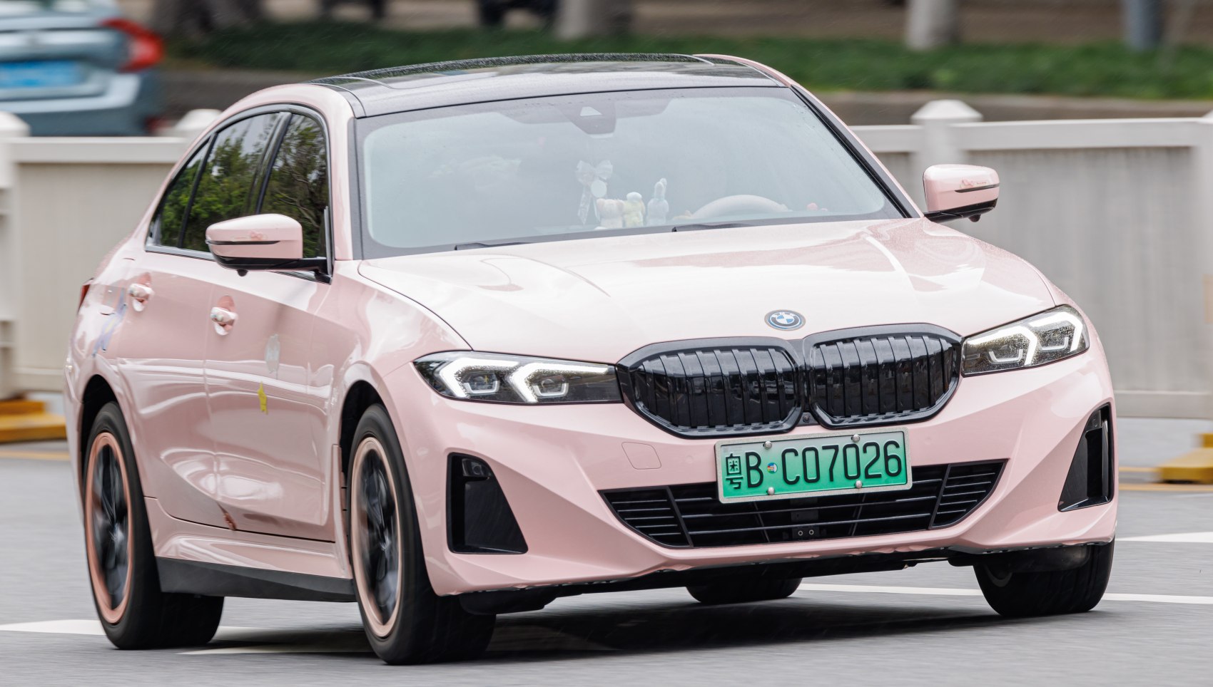 Pink sedan front with LED headlights and kidney grille
