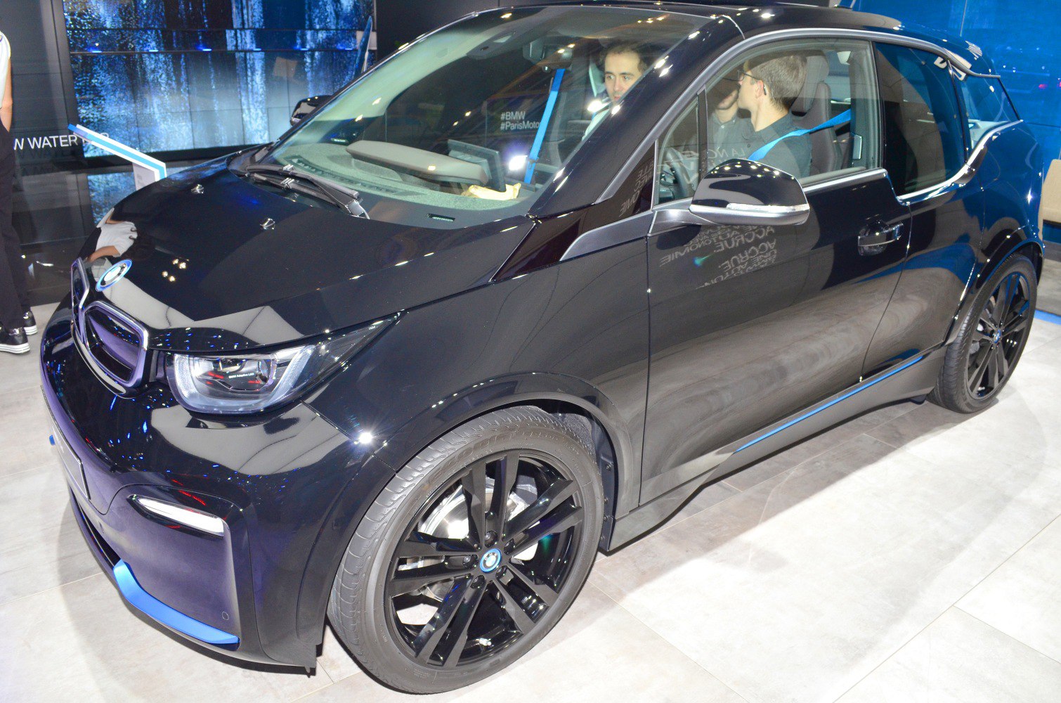 Sleek front fascia, LED headlights, black alloy wheels on electric compact hatchback