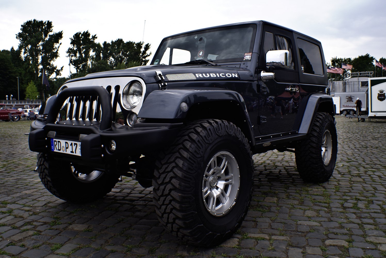 Lifted off-road SUV with rugged front grille and large tires