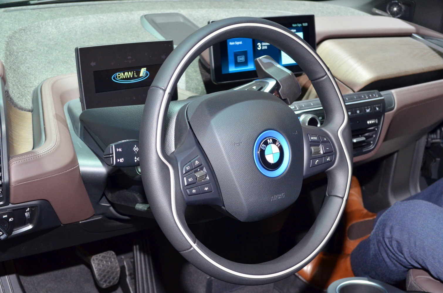Steering wheel with control buttons and digital dashboard display