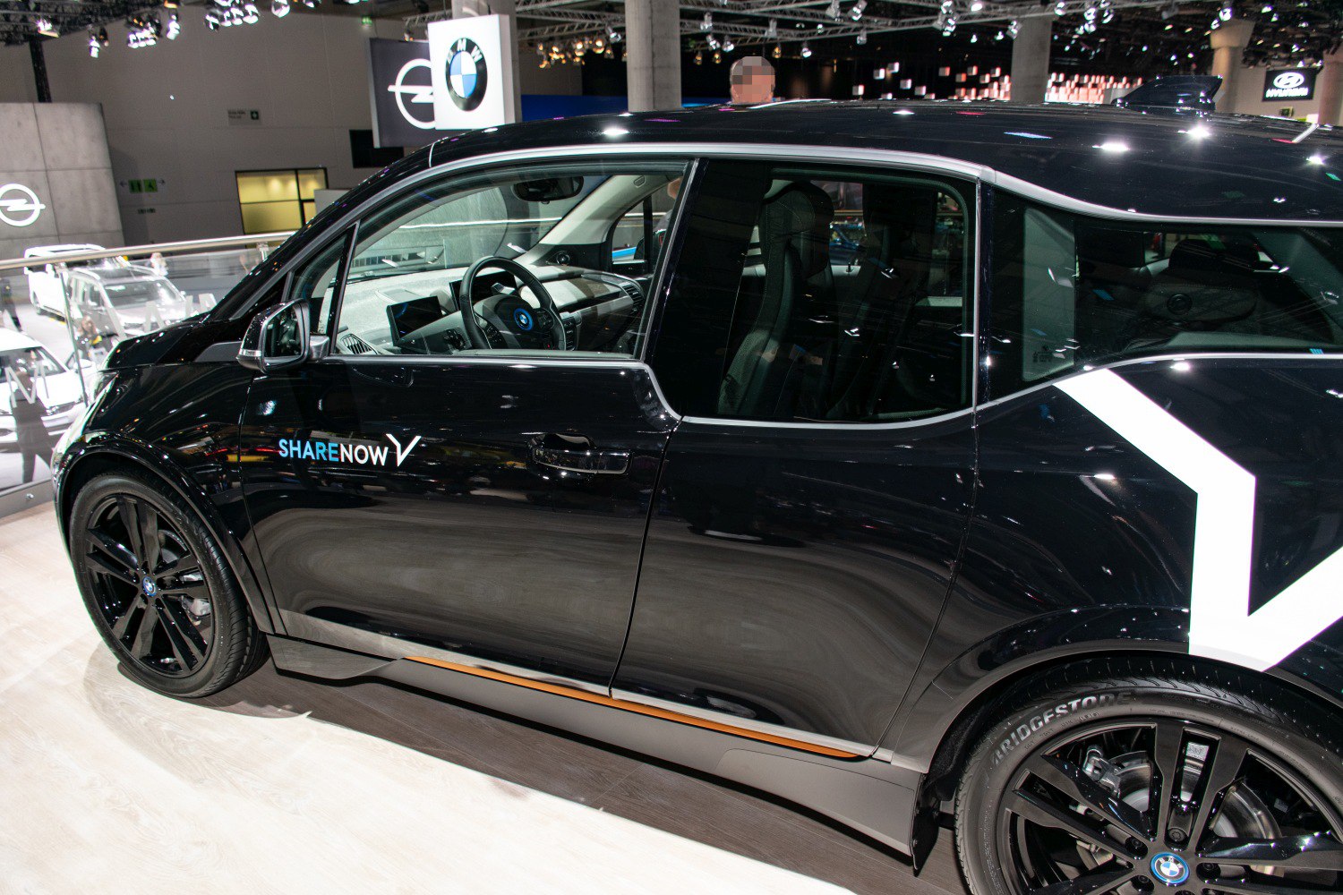 Black BMW i3s side with SHARE NOW branding and black alloy wheels