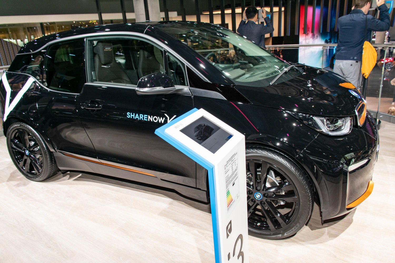 Black electric hatchback with sleek modern design and black wheels