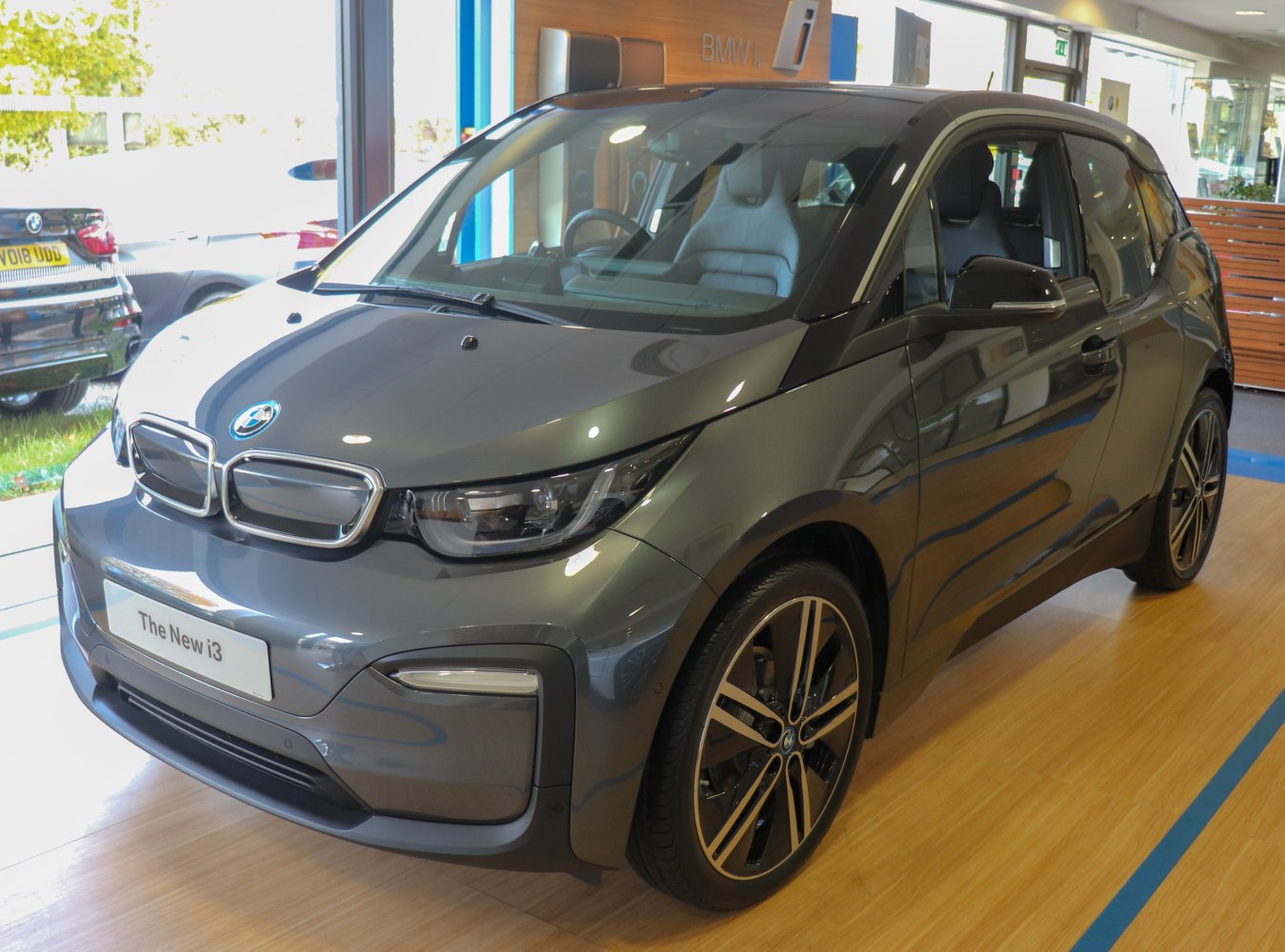 Front three-quarter view of modern electric hatchback with sleek design.