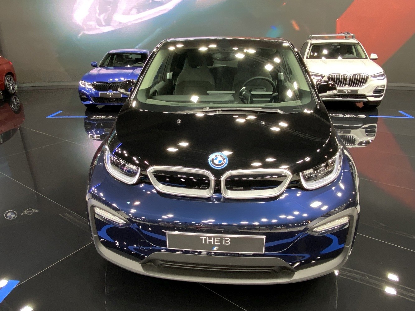 Front view featuring the kidney grille and LED headlights of a compact electric hatchback