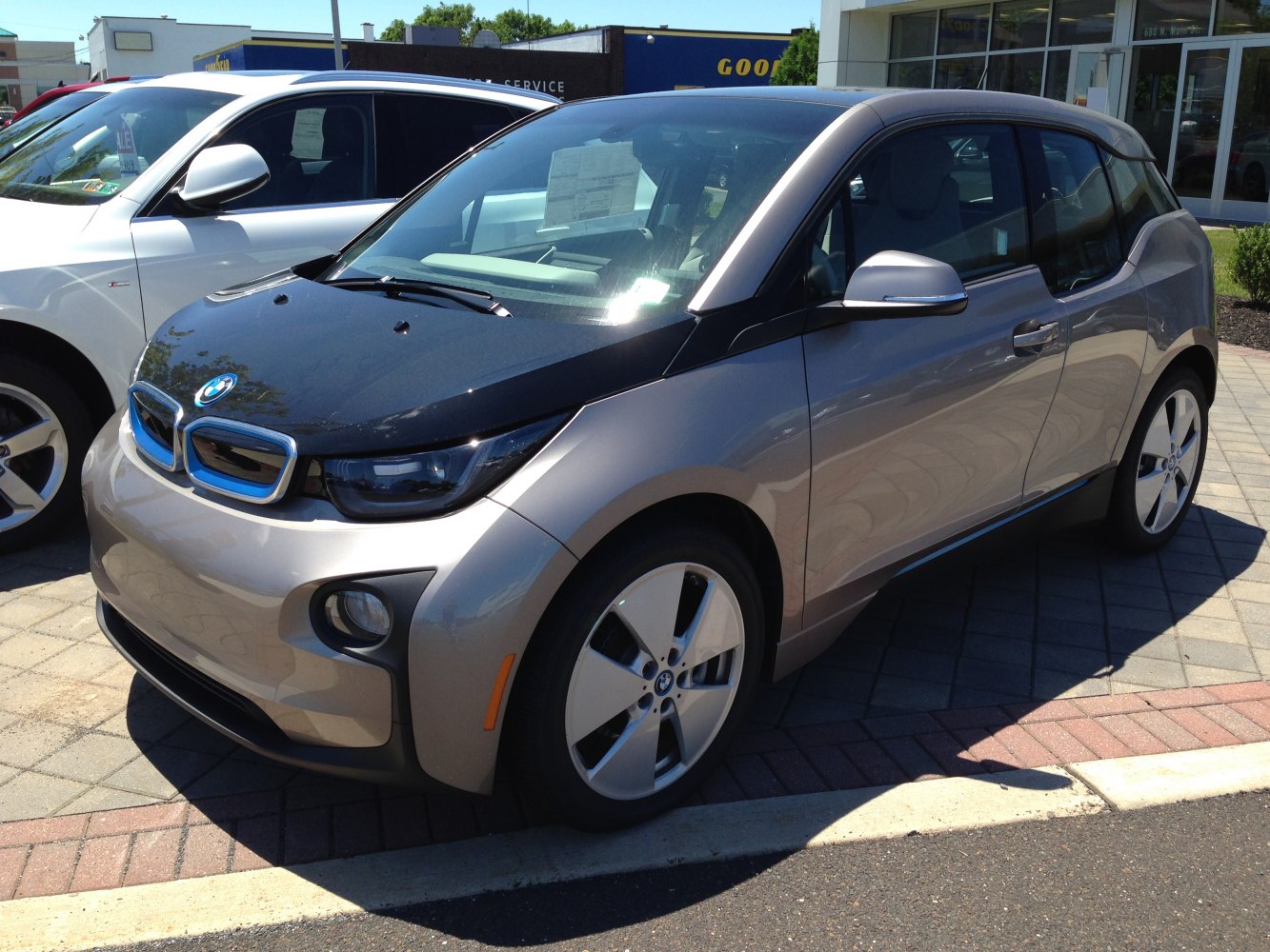 Front and side view of compact electric hatchback with kidney grille and aerodynamic body
