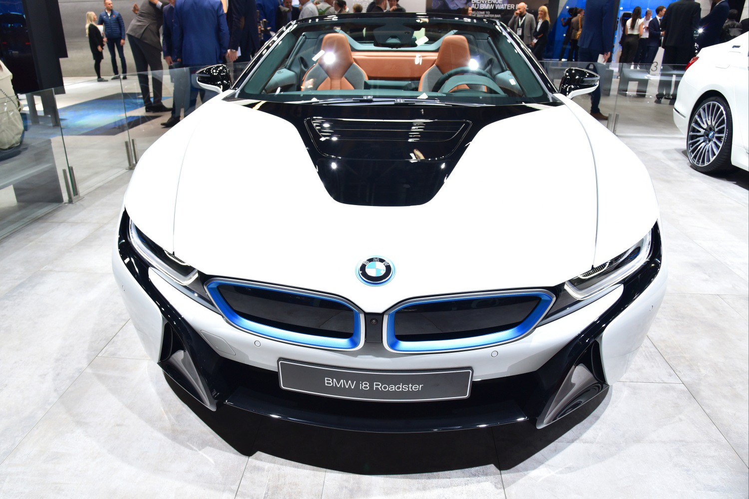 Front view with blue-accented kidney grille and sporty aerodynamic design.