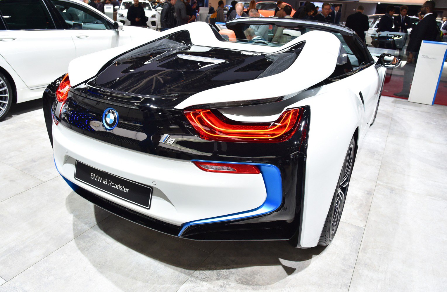 Rear view with dynamic LED tail lights and sporty hybrid roadster design.