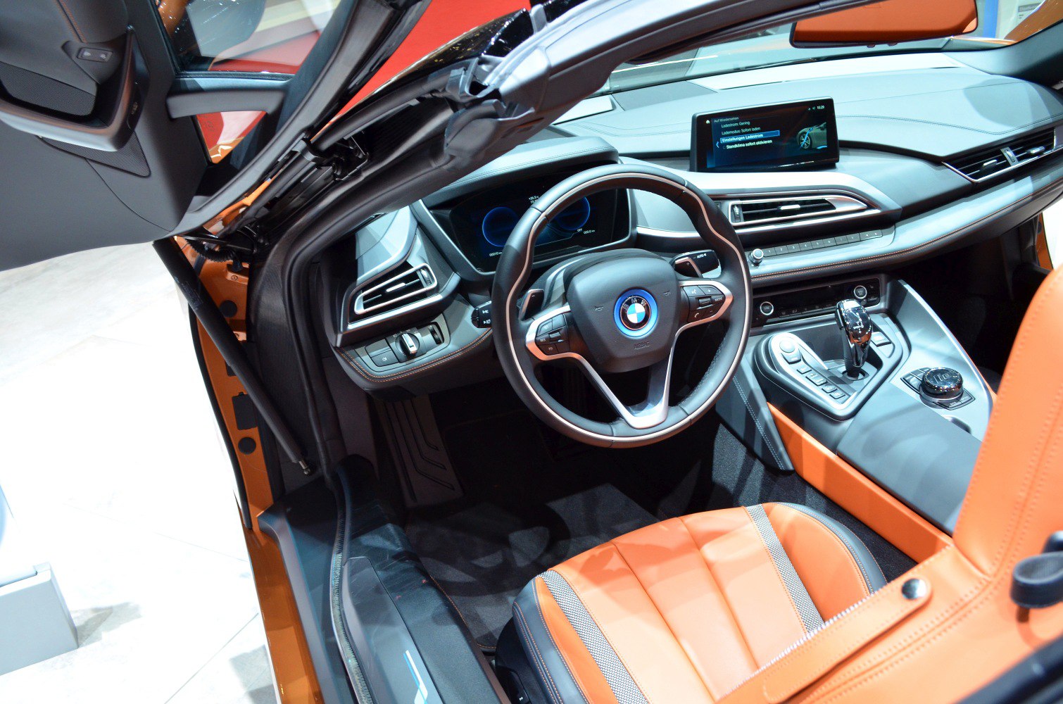 Futuristic interior with digital dashboard and distinctive steering wheel