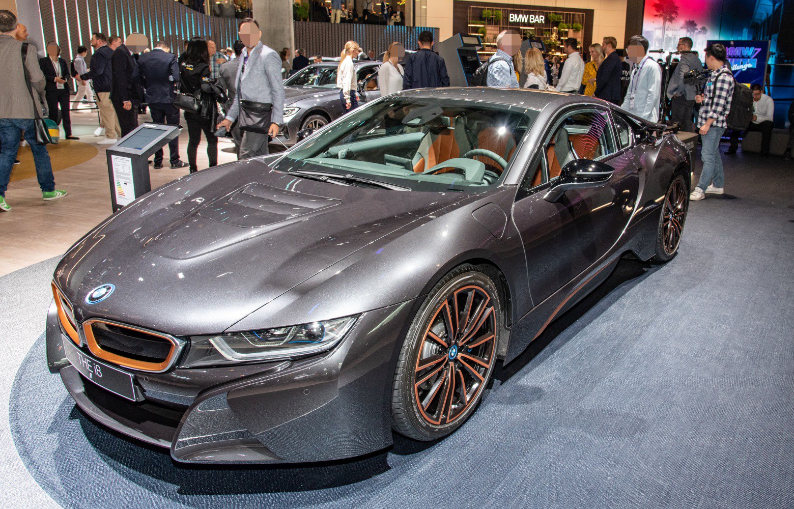 Sleek front end and distinctive wheel design of a sports coupe