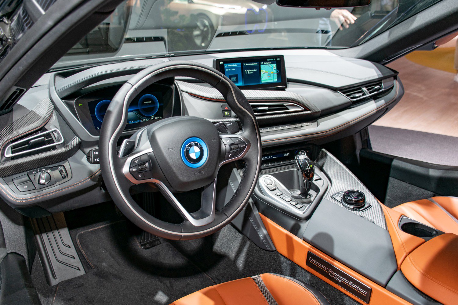 Modern steering wheel and digital dashboard with center console controls