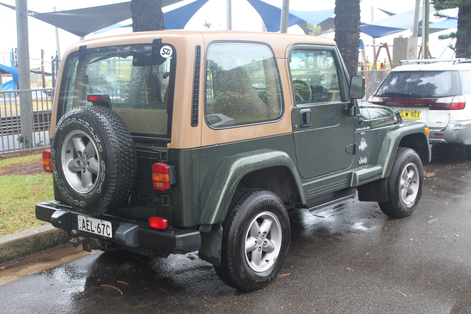 Beige hardtop with rear-mounted spare tire on off-road SUV