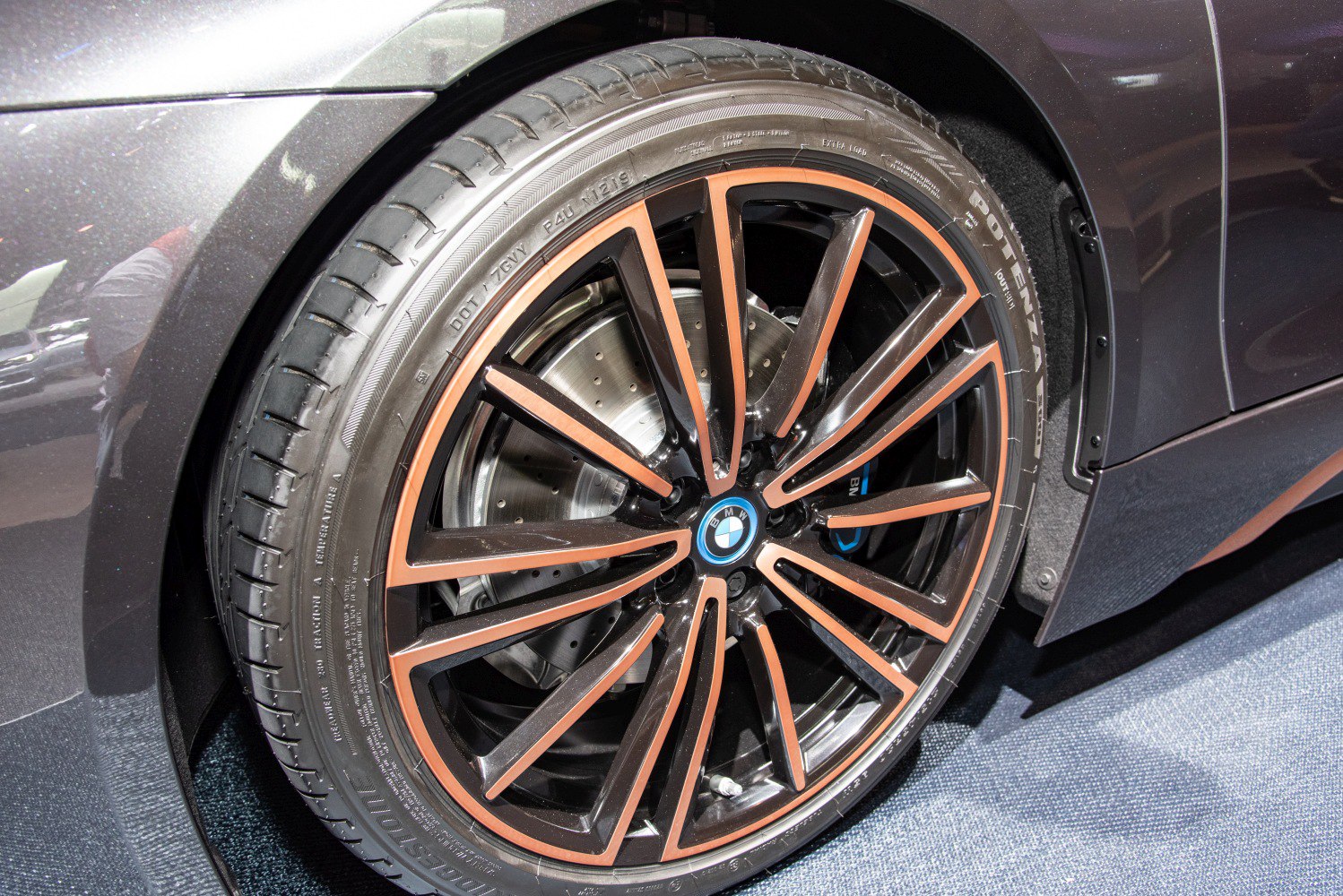 Alloy wheel with performance tire and disc brake close-up