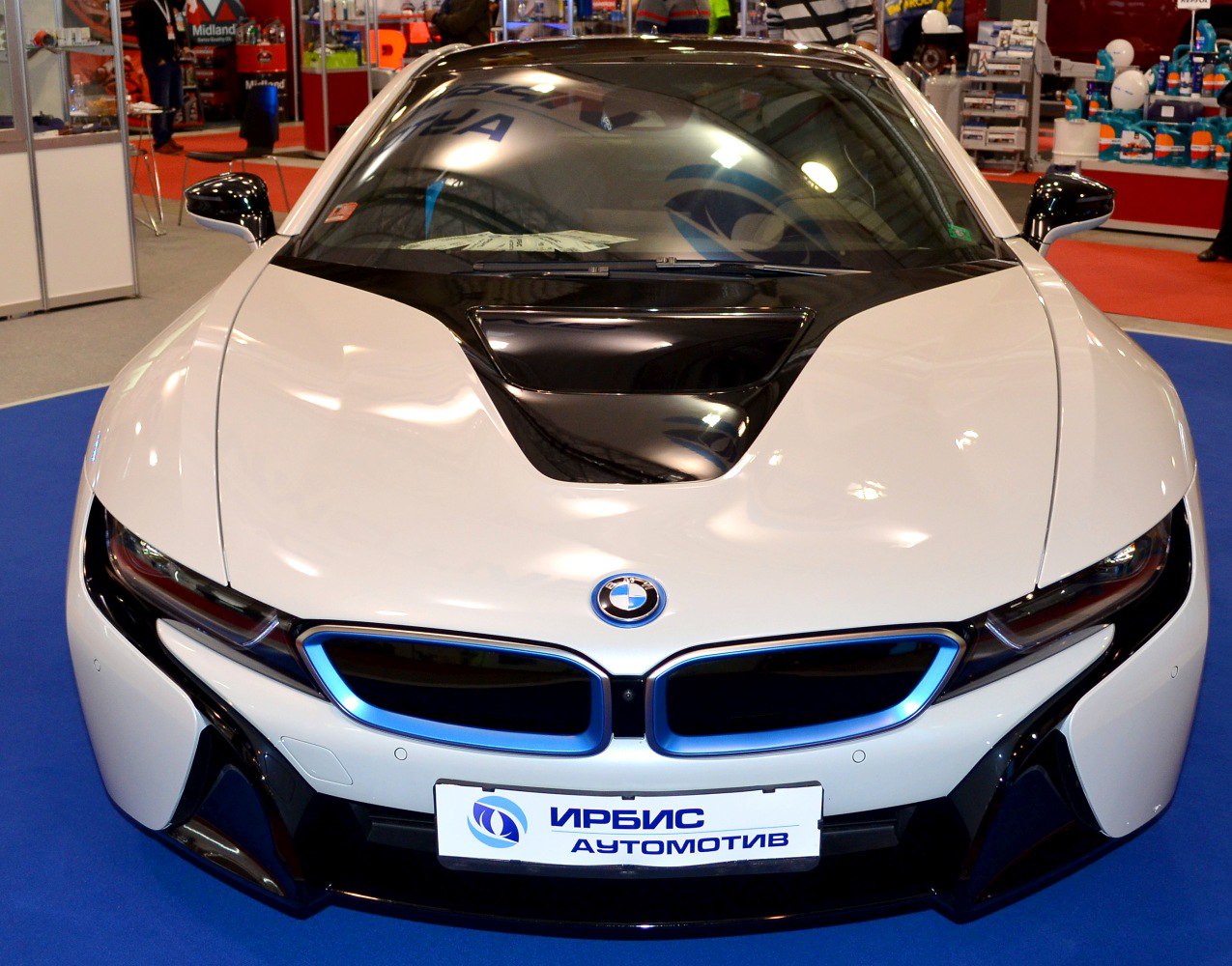 Front view of a sleek sports coupe with kidney grilles and blue accents.