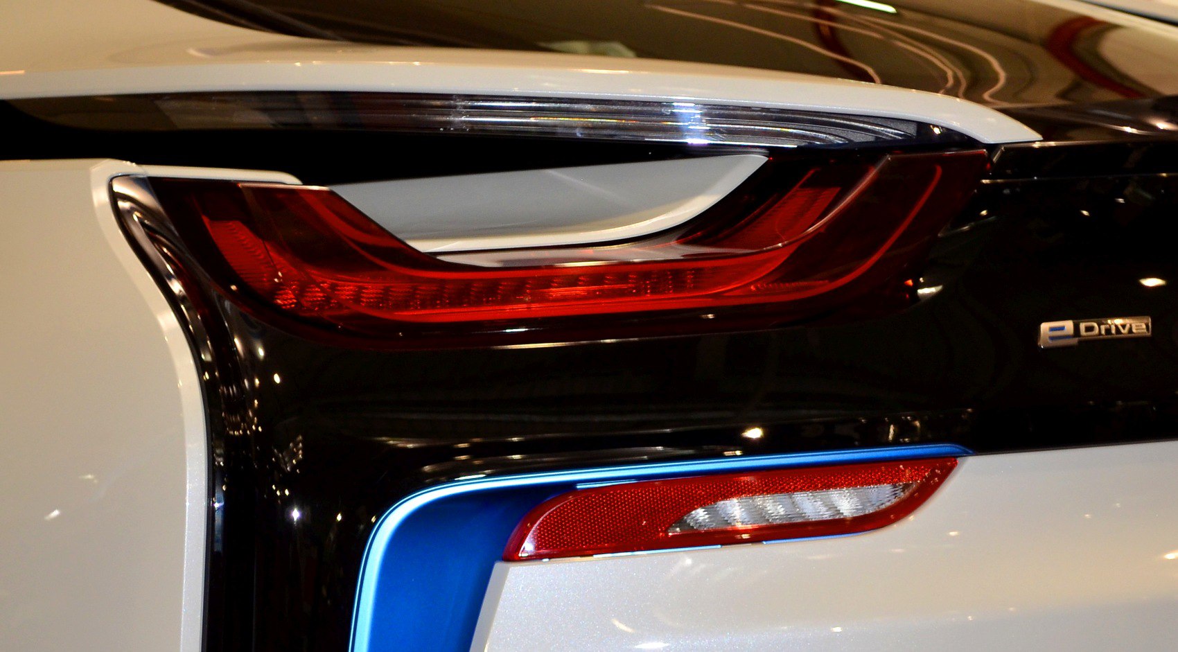 LED rear tail light and eDrive emblem on a two-tone car rear