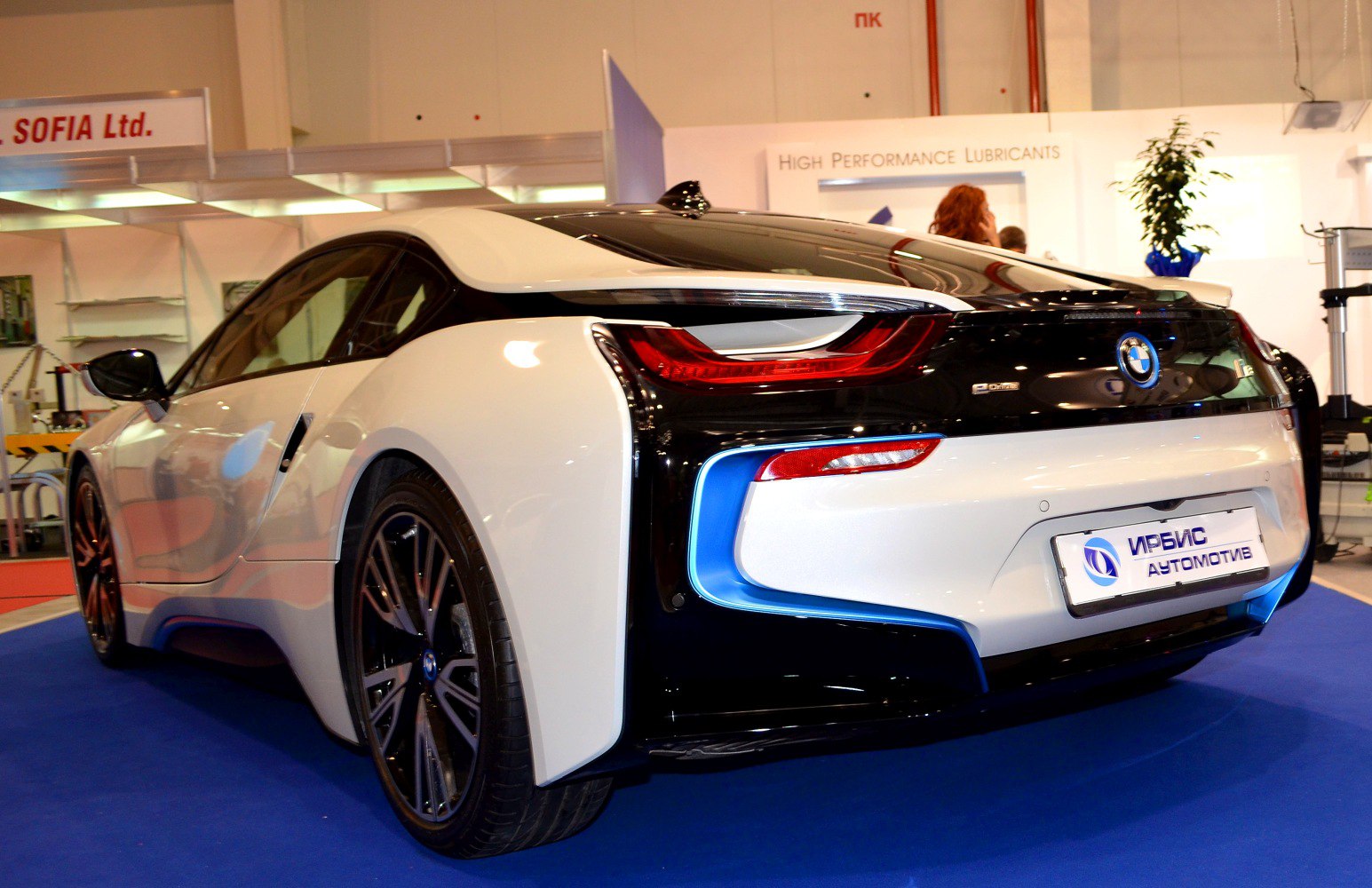 Aerodynamic rear side view with distinct tail lights and sleek wheel design