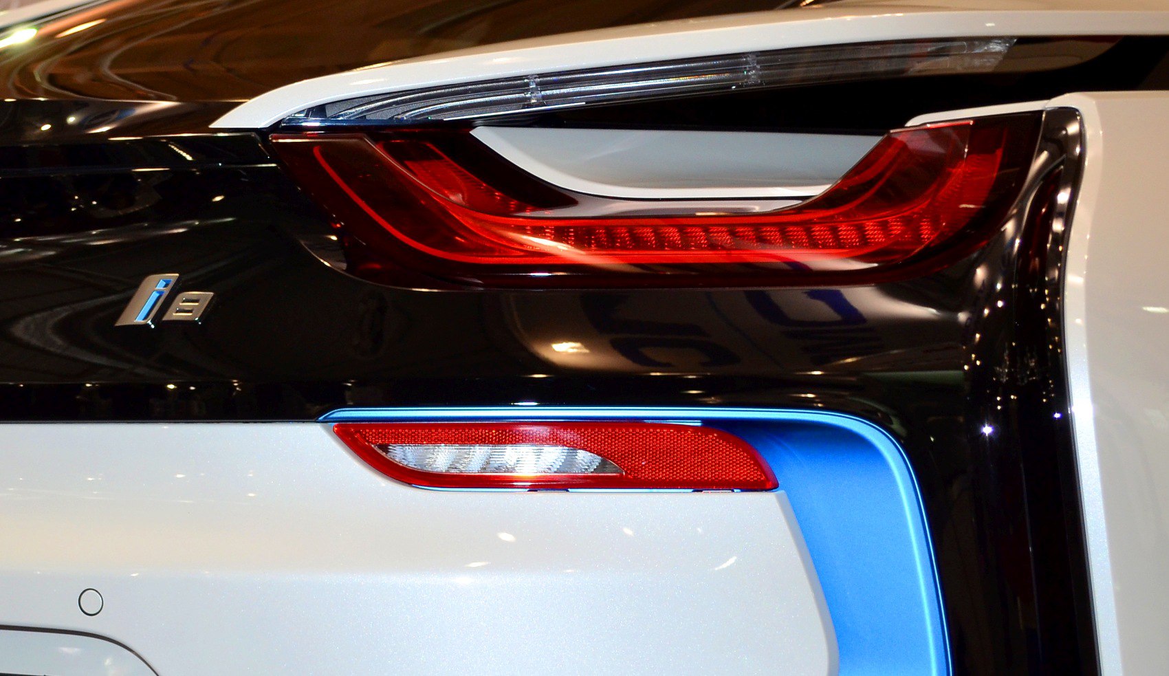 Rear light and badge close-up of sleek modern sports coupe