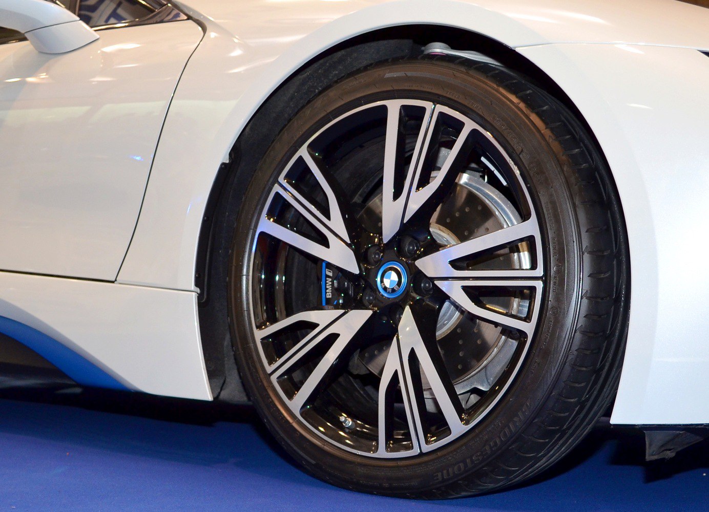 Close-up of a front wheel with a modern alloy rim and brake disc.