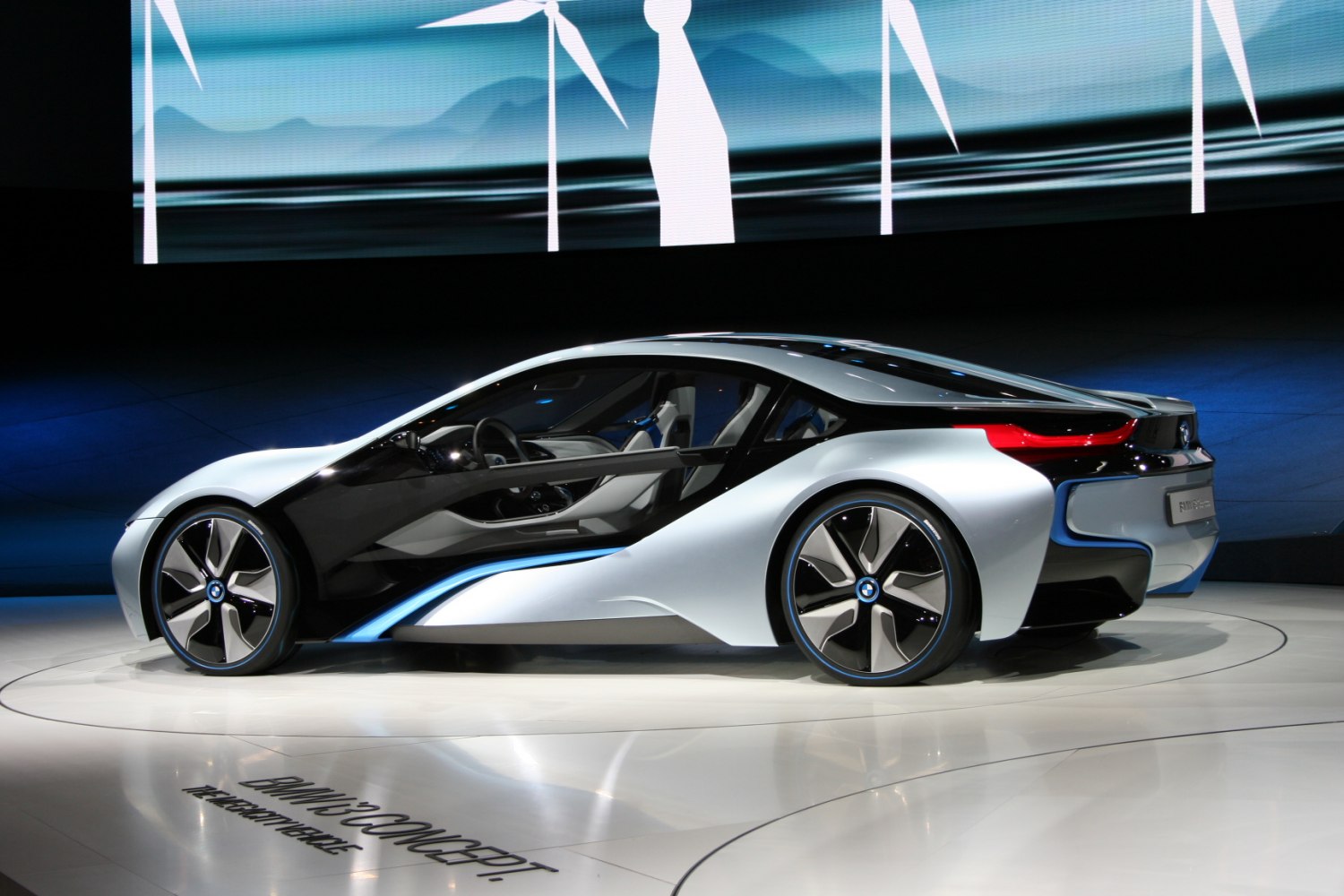 Futuristic aerodynamic coupe with innovative hybrid sports car design.