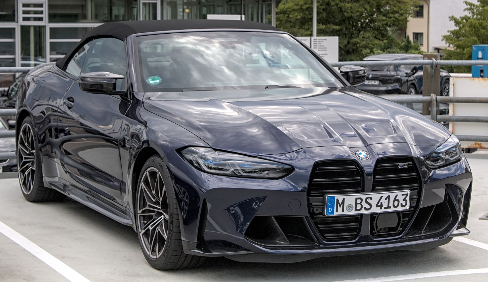 Front view of convertible with closed soft top and aggressive grille