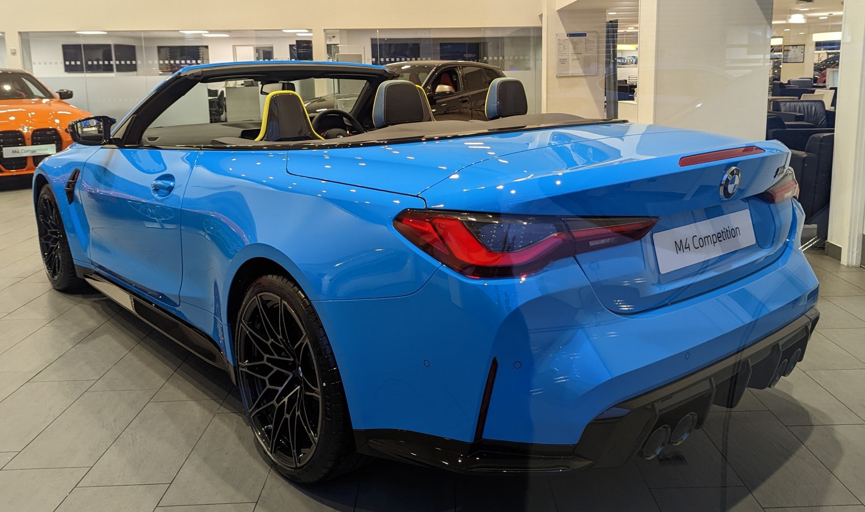 Blue convertible rear side with black alloy wheels