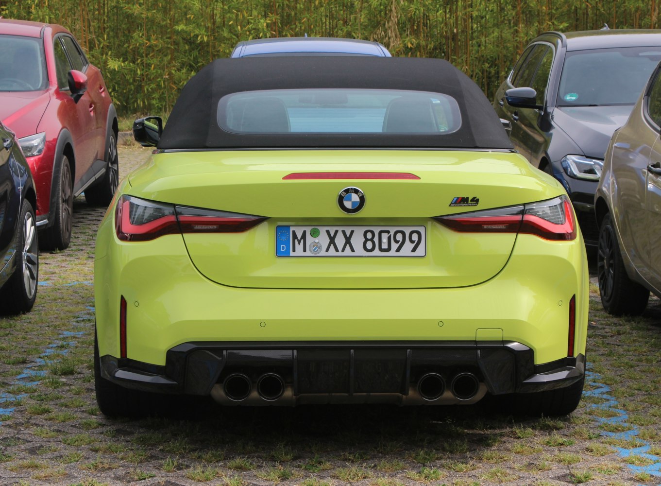 Rear view of sports convertible with quad exhaust and sleek taillights