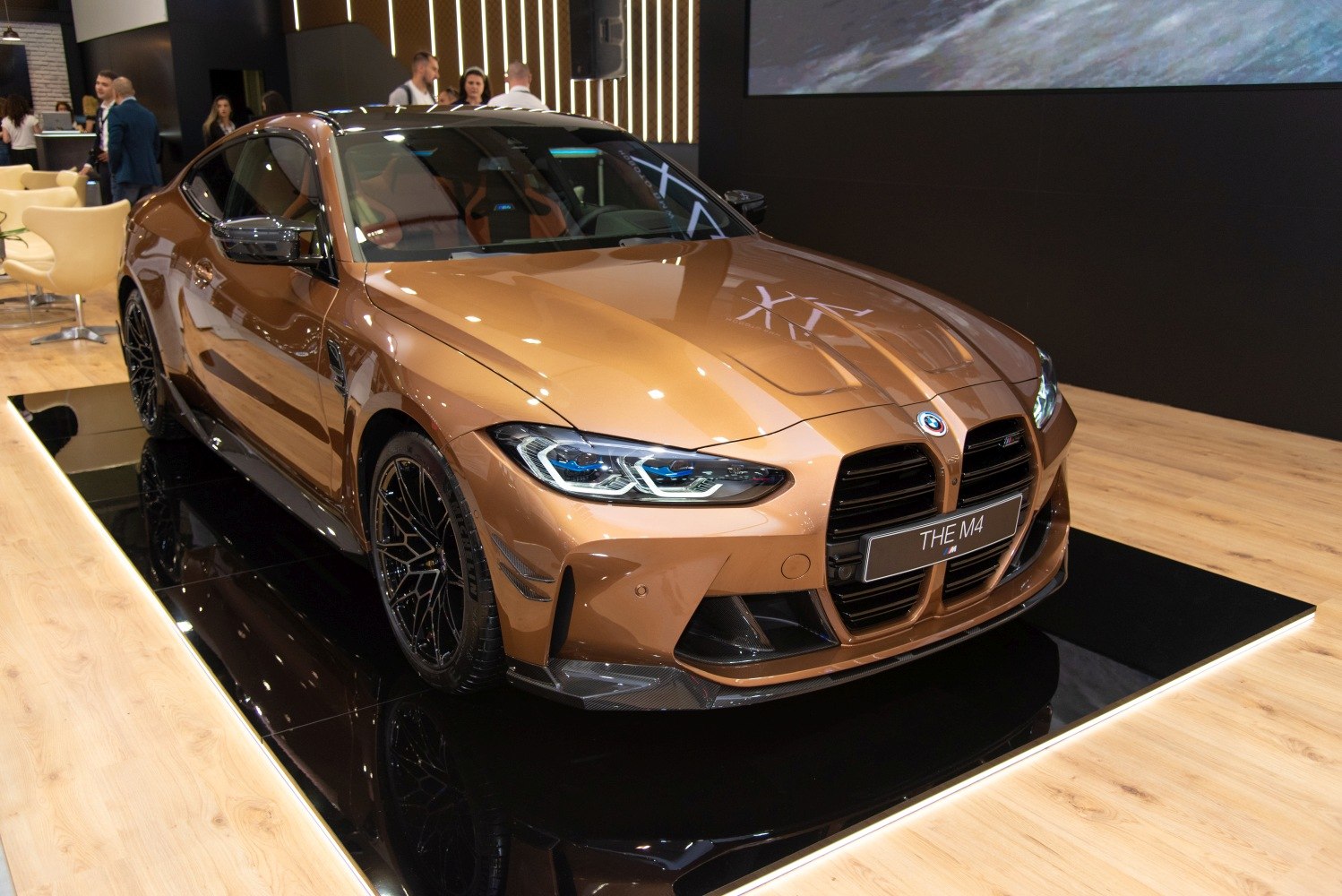 Front view with prominent large kidney grille and aggressive headlights