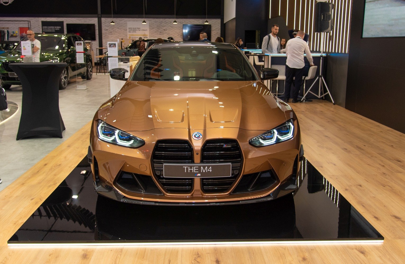 Aggressive front kidney grille and LED headlights on a sleek sports coupe