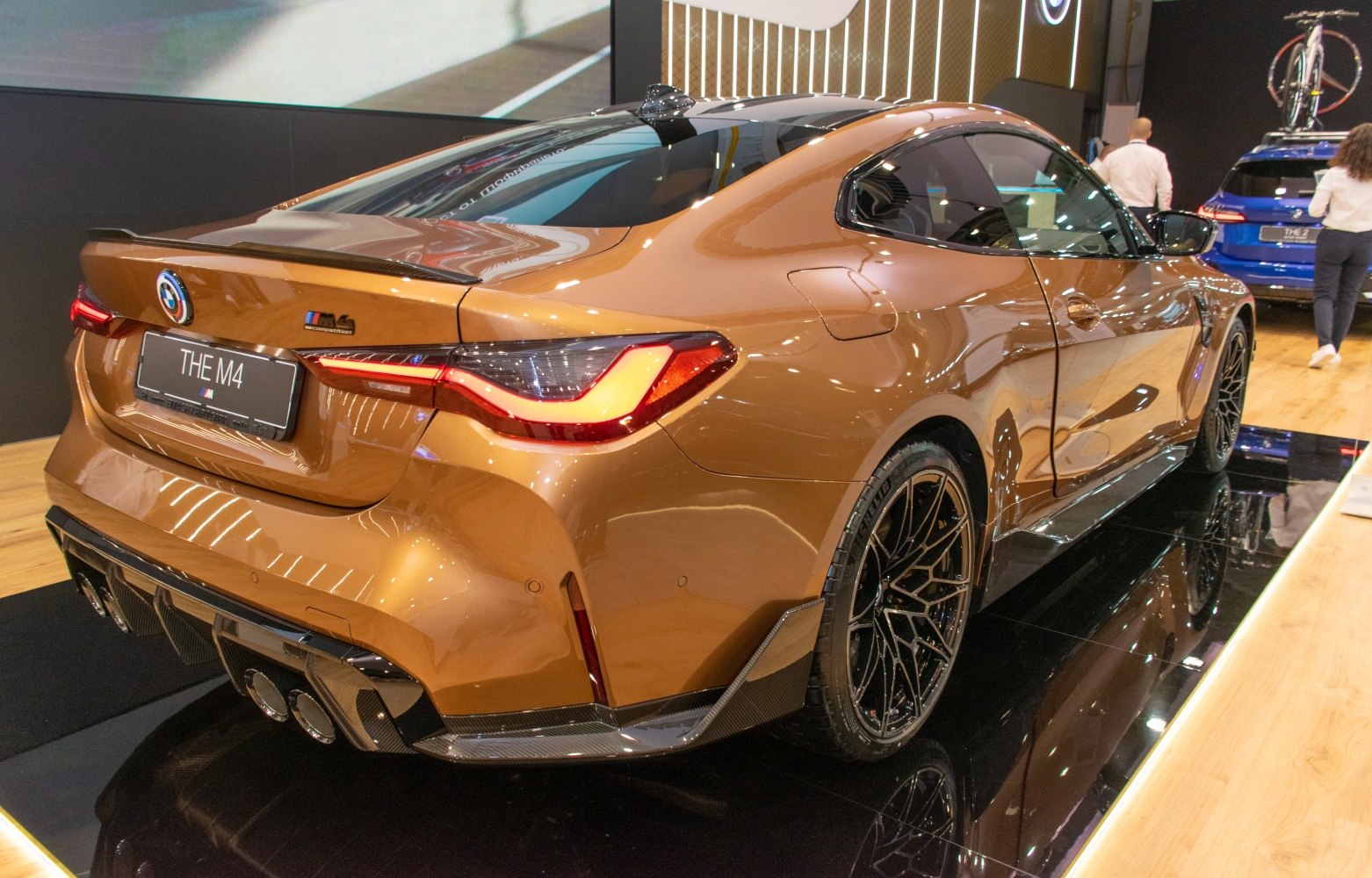 Rear angled view with carbon fiber diffuser and quad exhaust tips