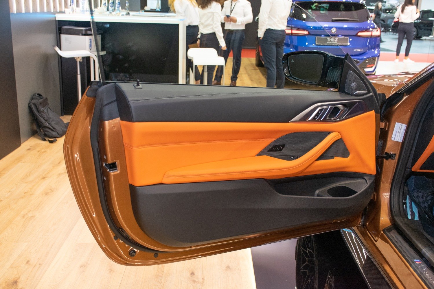 Orange and black leather door panel with modern controls