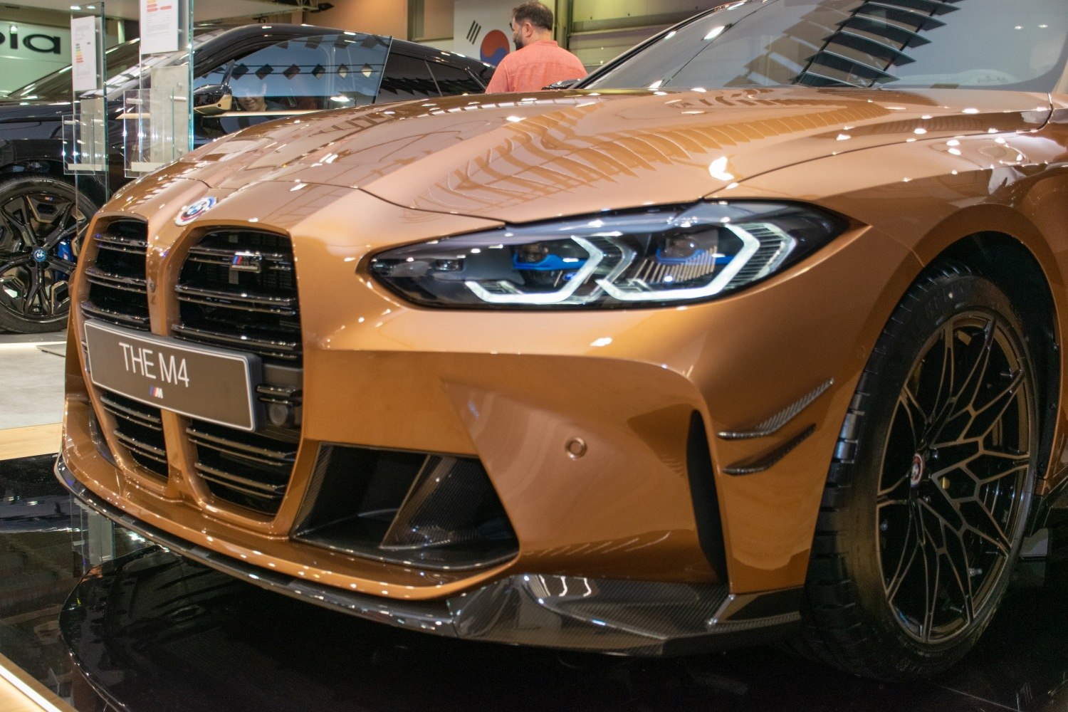 Aggressive front grille and distinctive LED headlights on a modern coupe.