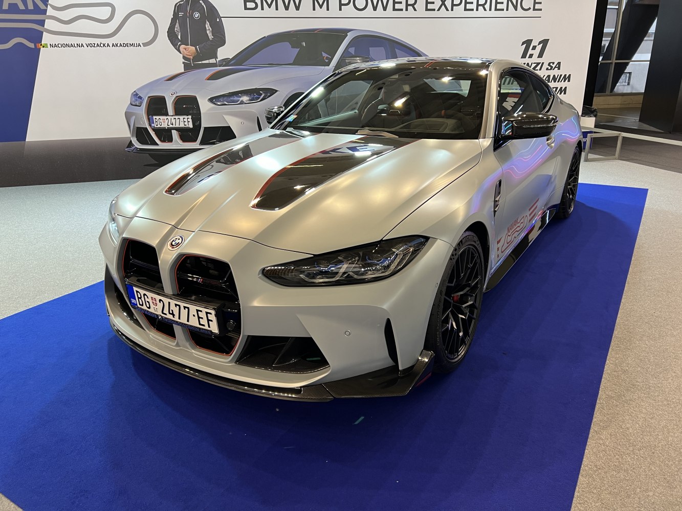 Aggressive front grille and carbon fiber hood vents with black wheels