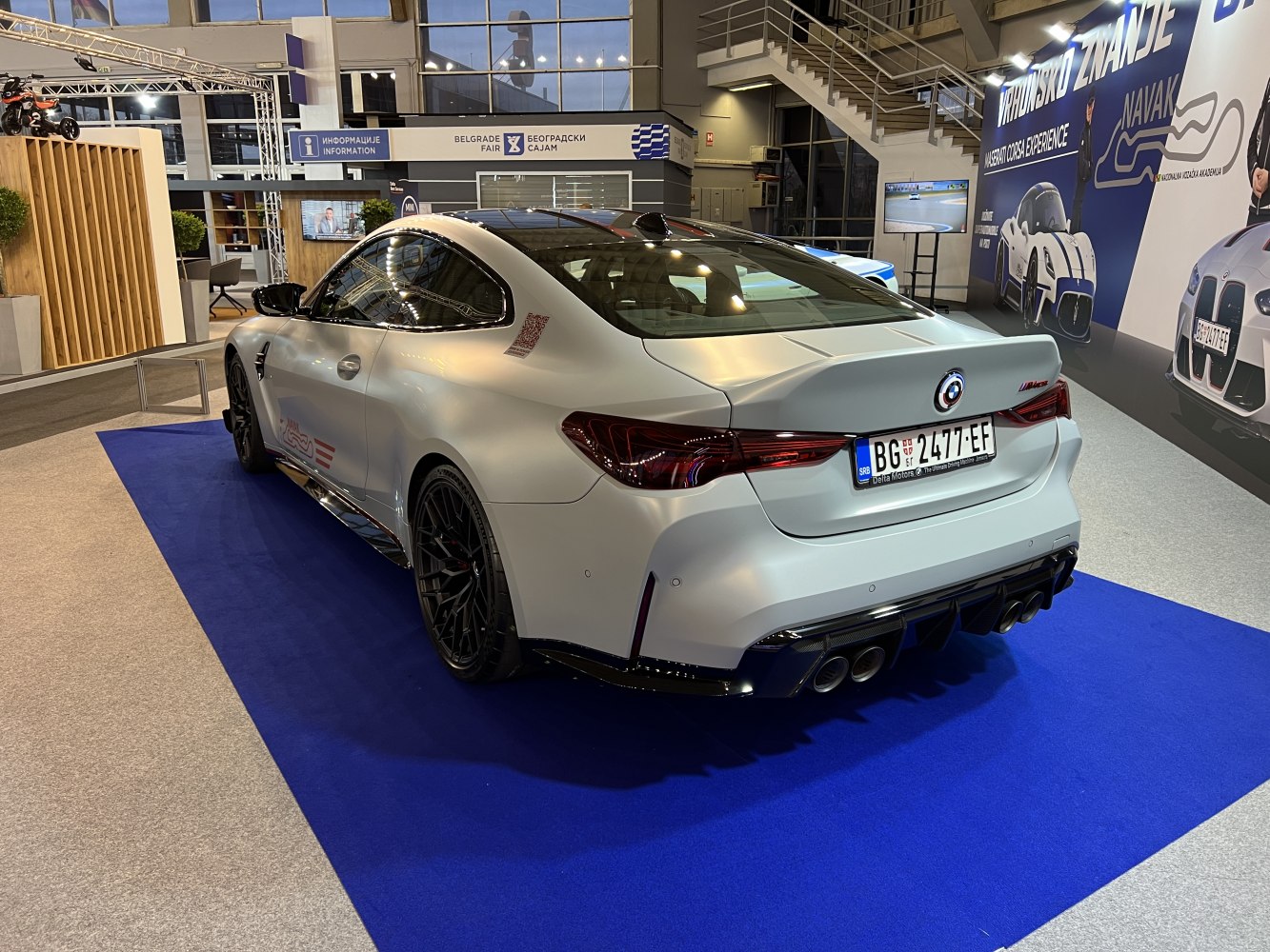 Rear view of sporty coupe with quad exhaust and sleek taillights
