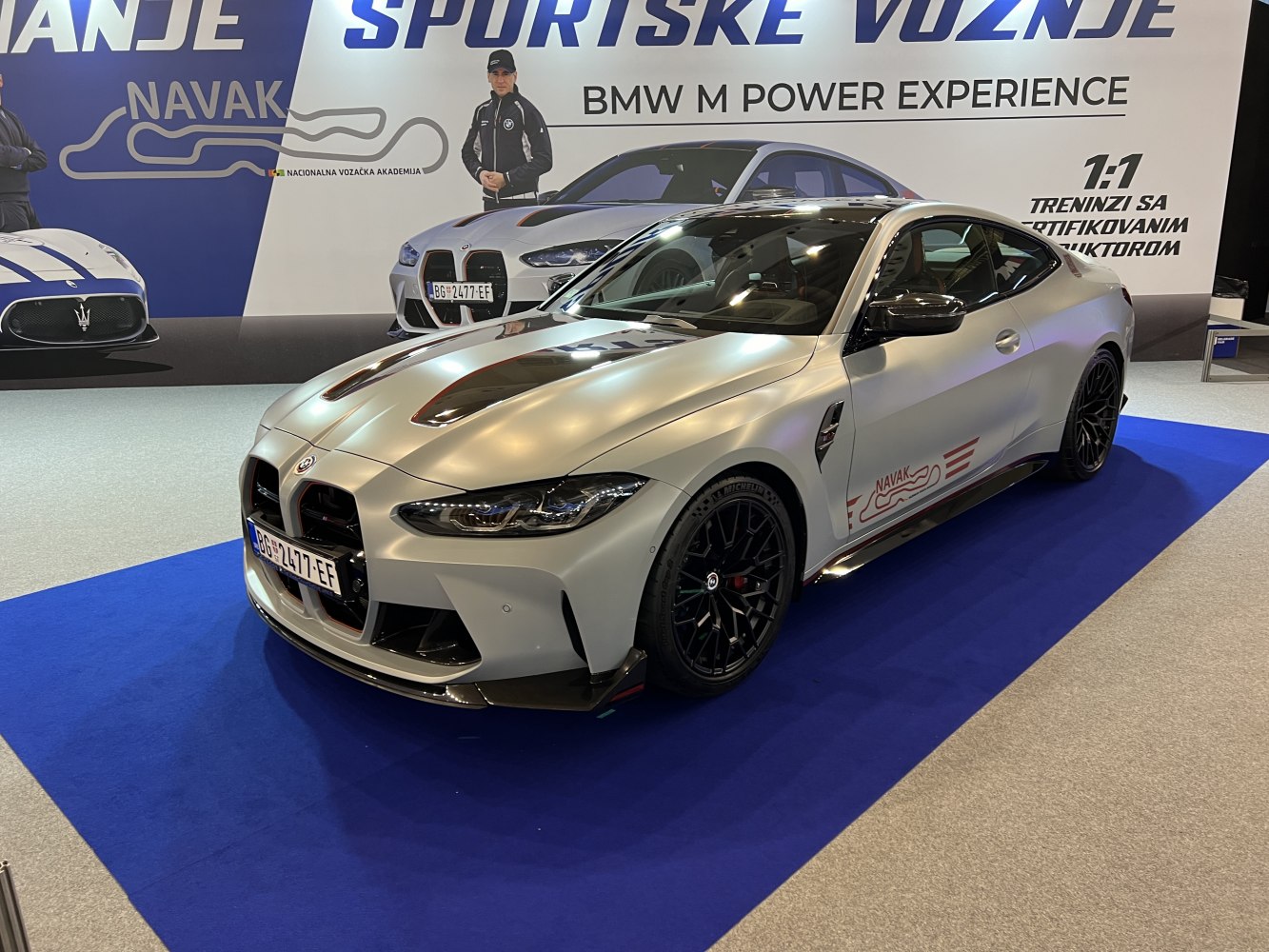 BMW sports coupe with aggressive front, aerodynamic vents, black wheels
