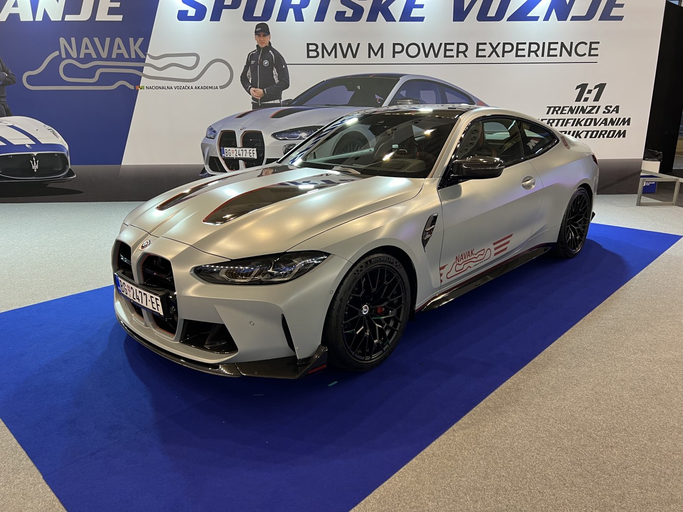 Matte silver sports coupe with black aerodynamic accents and sporty wheels