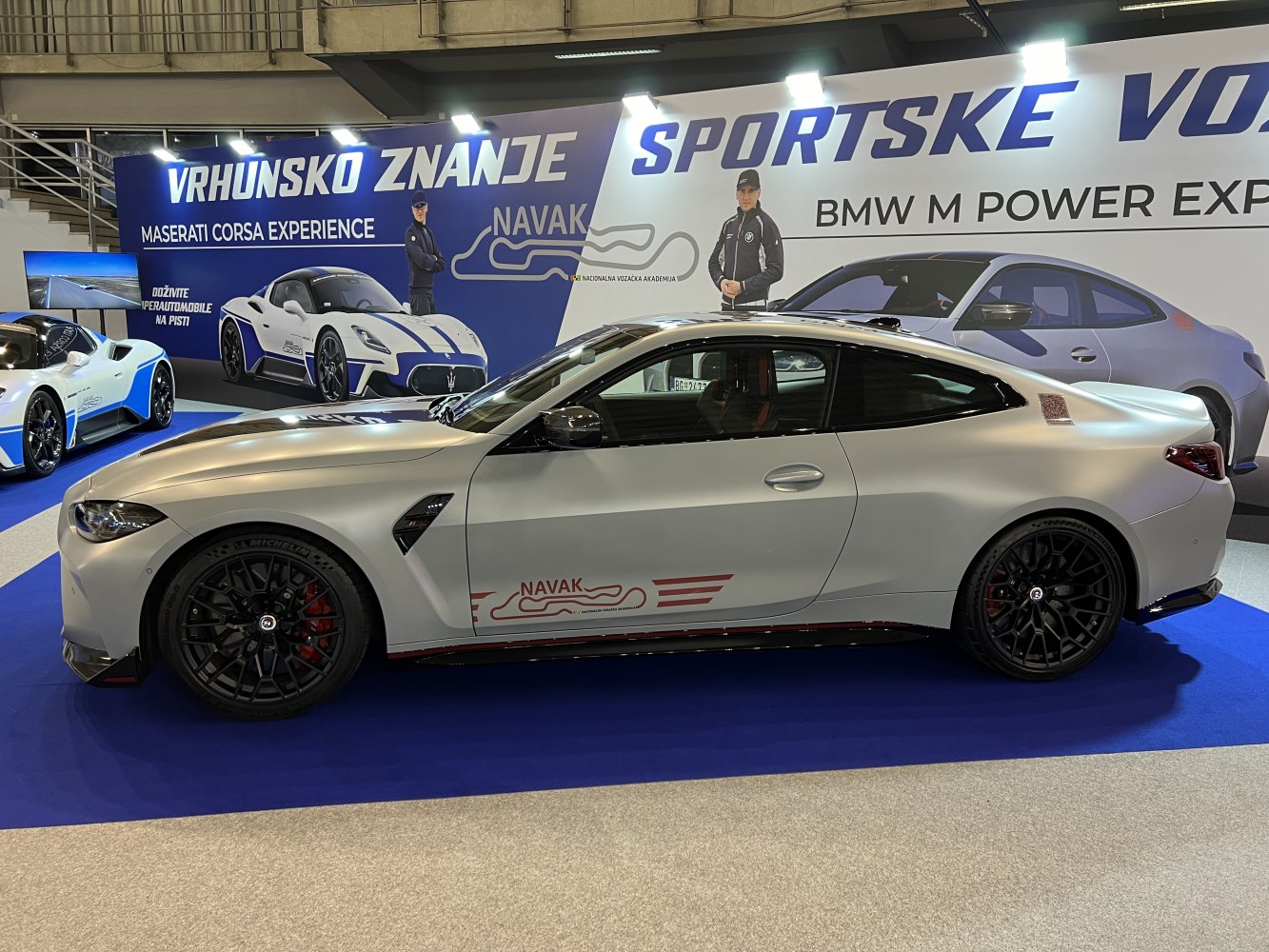 Matte paint BMW coupe with black wheels and red brake calipers