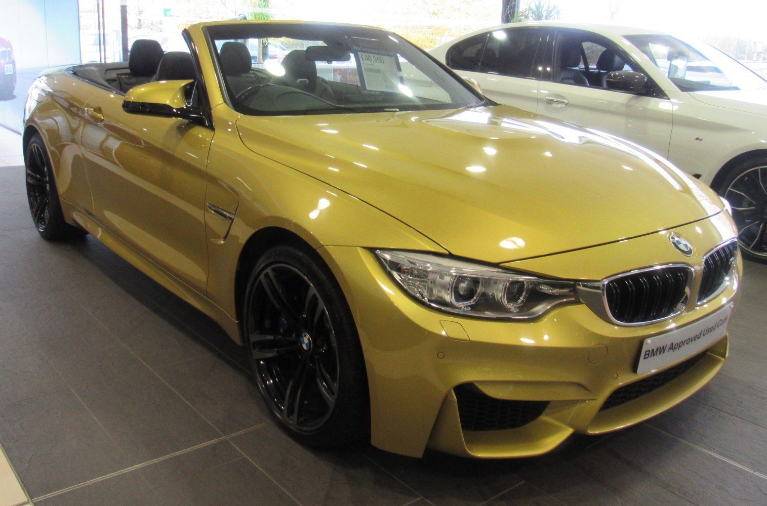 Front angled view of convertible with black alloy wheels