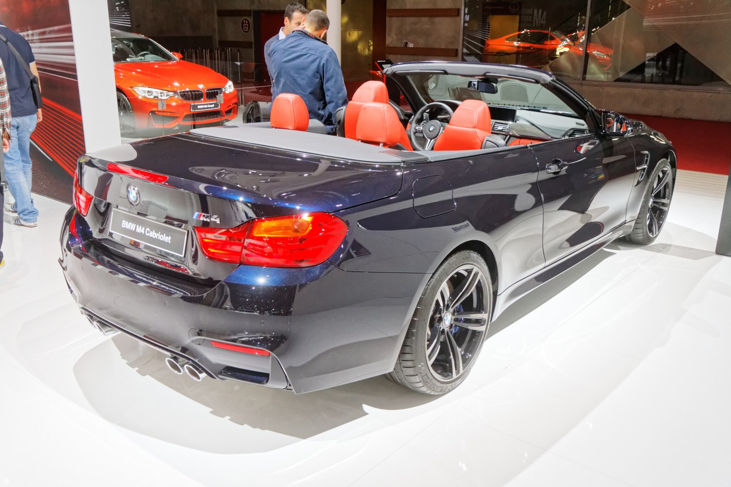 Convertible rear view with red interior seats and sporty dual exhaust