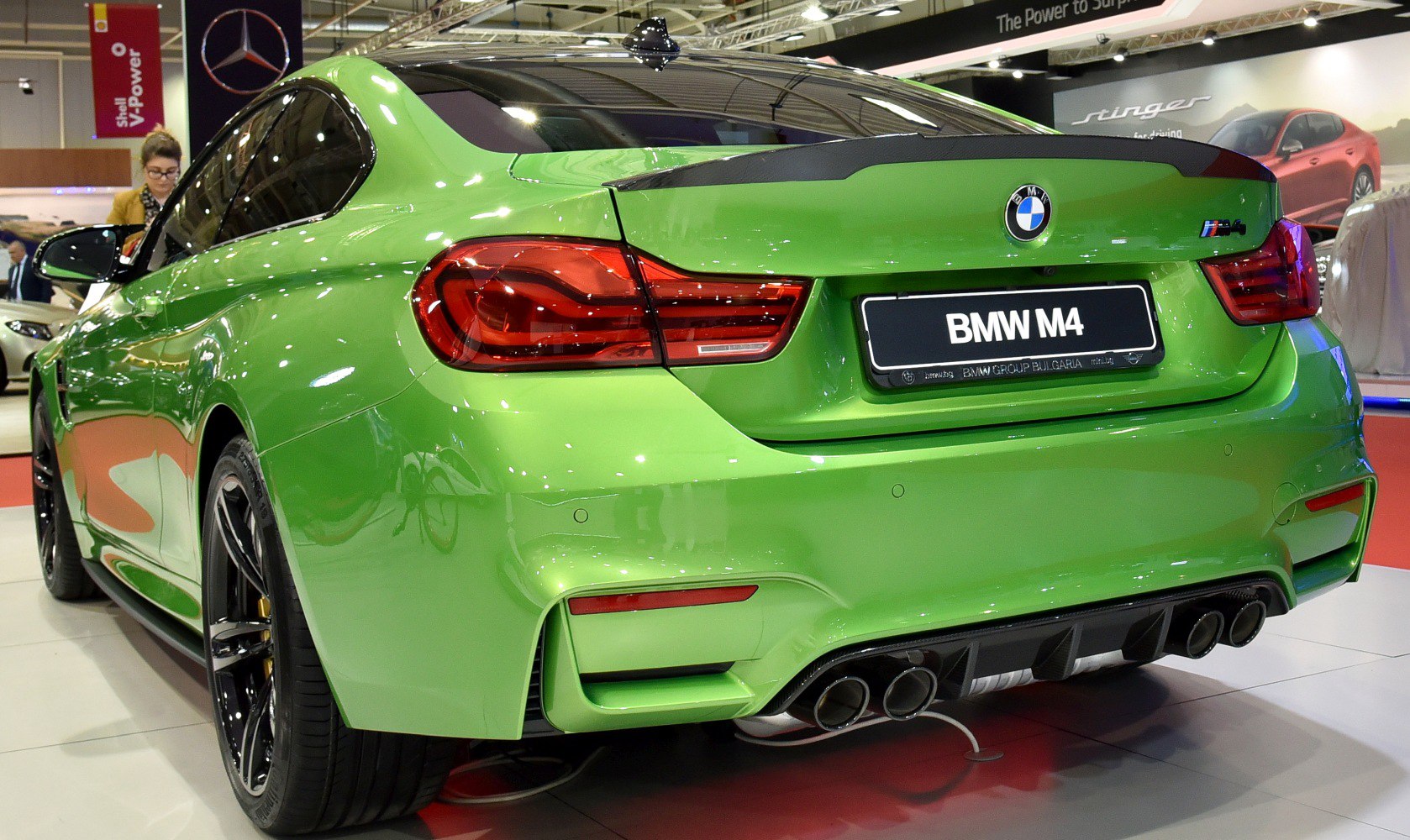 Rear view with quad exhaust and diffuser in vibrant green paint